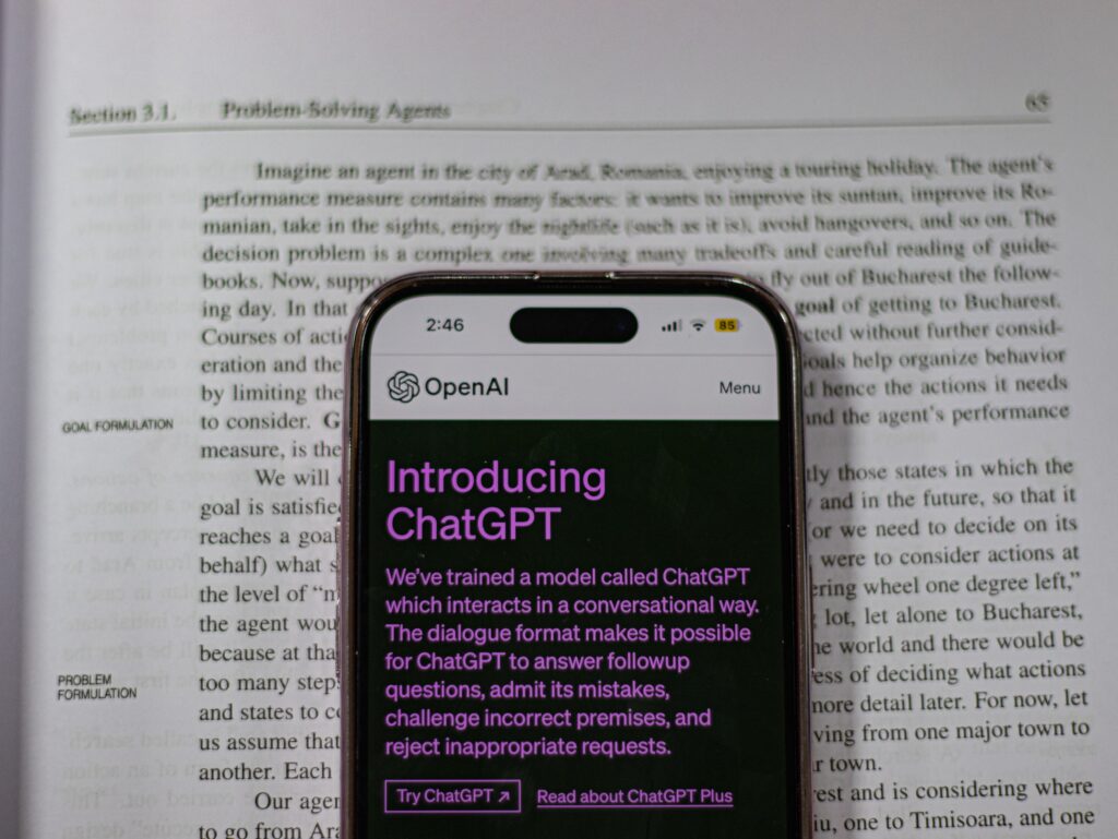 Alt text: "A graphic representing the Chatwithpdf chatgpt plugin in action, with a PDF document on a computer screen and speech bubbles showing the dynamic interaction enabled by the plugin.