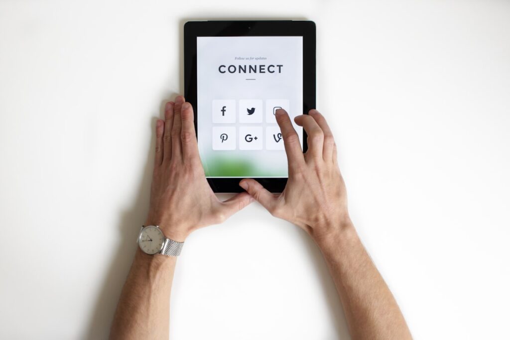 How to grow Instagram followers organically 2025 - person using Instagram app on phone showing follower count growth and engagement stats